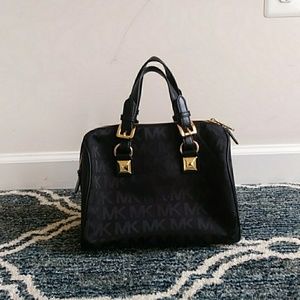 Black and gold Michael Kors handbag